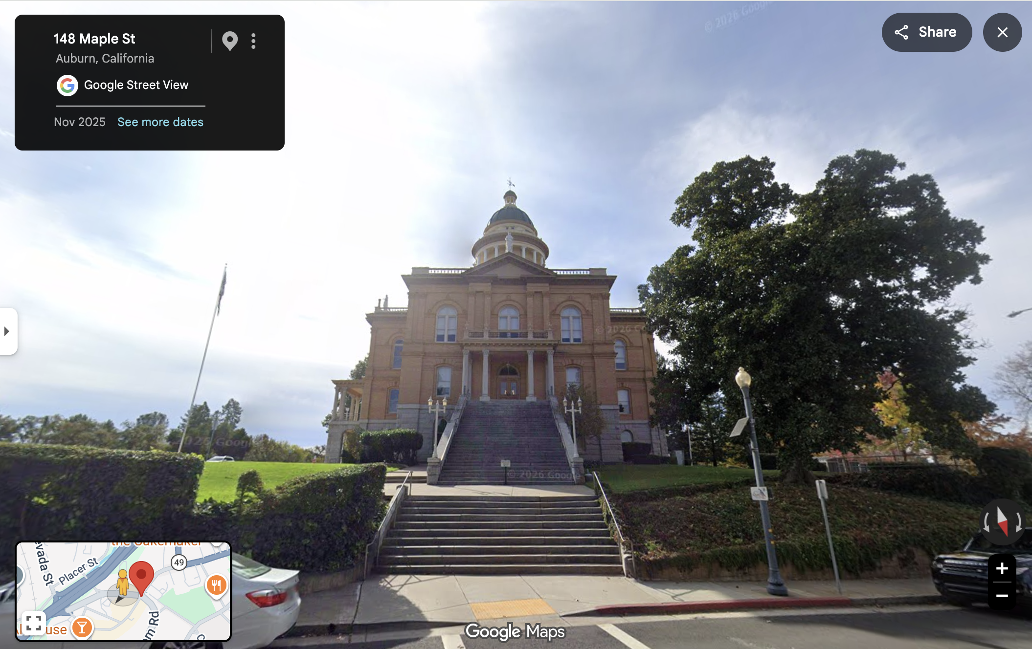 ALPR camera on a streetlight with a solar panel, in front of the Auburn courthouse